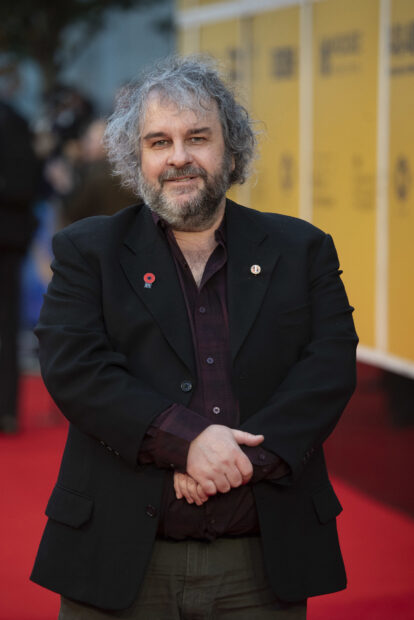 Peter Jackson stands smiling on the red carpet at an event, HD Mobile Wallpaper