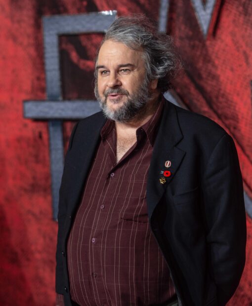 Peter Jackson smiles warmly wearing a striped shirt and black blazer at an event, 2K Desktop Wallpaper
