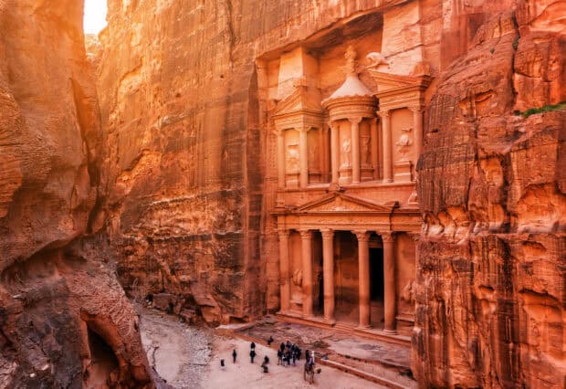 Tourists exploring the ancient rock architecture of Petra in Jordan, HD Desktop Wallpaper