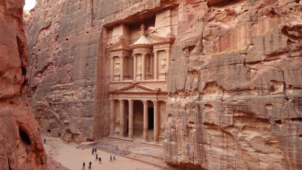 The ancient rock carving of Petra Jordan attracts many visitors exploring the historic site, 2K Desktop Wallpaper
