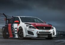 A Peugeot 308 racing car is parked on a wet racetrack under a stormy sky, 4K Desktop Wallpaper