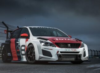 A Peugeot 308 racing car is parked on a wet racetrack under a stormy sky, 4K Desktop Wallpaper