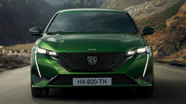 A green Peugeot 308 is driving on a road with mountains in the background, HD Desktop Wallpaper