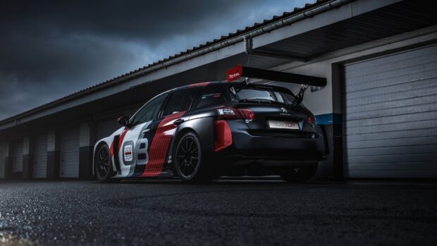A Peugeot 308 race car with red and white stripes parked under a cloudy sky, 4K Desktop Wallpaper