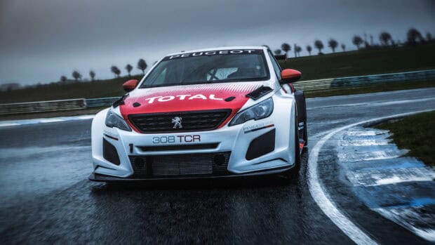 A Peugeot 308 is captured driving on a wet racetrack with clear sponsor logos, HD Desktop Wallpaper