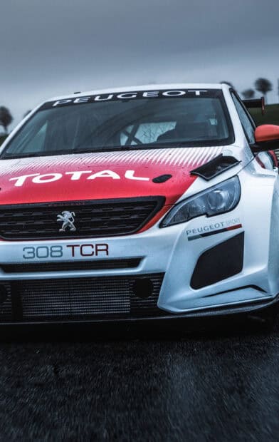 A Peugeot 308 car with racing decals parked on a wet road, HD Phone Wallpaper