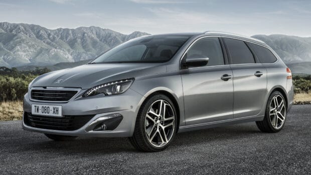 A silver Peugeot 308 is parked on the road with mountains in the background, HD Desktop Wallpaper