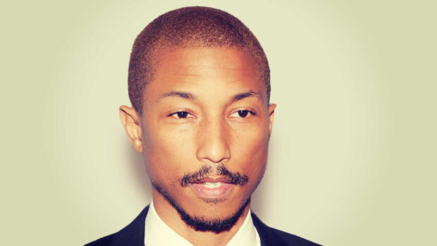 Pharrell Williams is wearing a suit and looking contemplative in the photo, HD Desktop Wallpaper