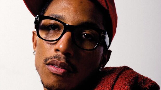Pharrell Williams is wearing black glasses and a red hat in this close up, HD Desktop Wallpaper