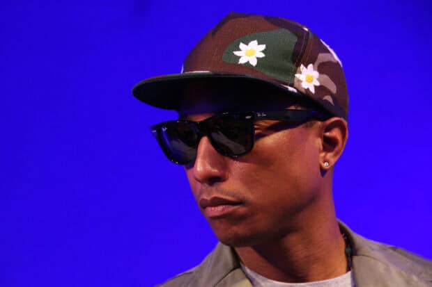 Pharrell Williams wearing sunglasses and a camo cap with flower details, HD Mobile Wallpaper