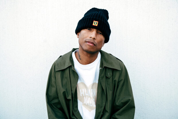 Pharrell Williams shows a casual look wearing a black beanie and green jacket, HD Desktop Wallpaper