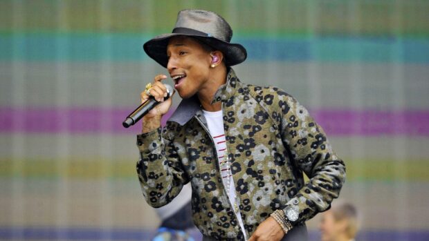 Pharrell Williams singing live in a patterned jacket at a concert, HD Desktop Wallpaper