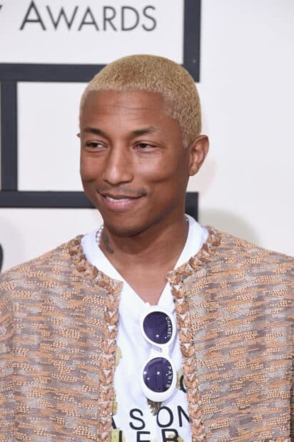 Pharrell Williams smiles warmly at the awards ceremony wearing a patterned jacket and sunglasses, HD Mobile Wallpaper