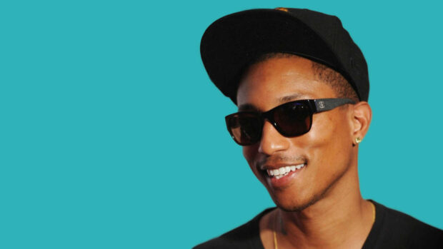 Pharrell Williams is wearing sunglasses and a black cap with a blue background, HD Desktop Wallpaper