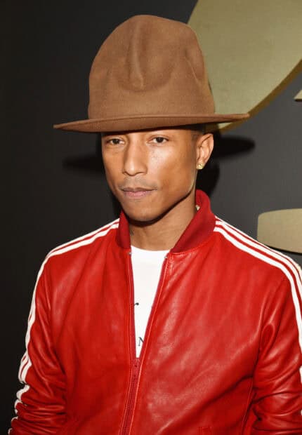 Pharrell Williams wears a brown hat and red jacket in a close up portrait, 2K Desktop Wallpaper