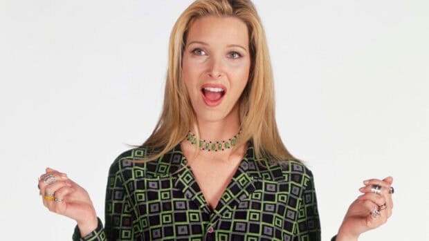 Phoebe Buffay is making a surprised face wearing a patterned shirt and green necklace, 2K Desktop Wallpaper