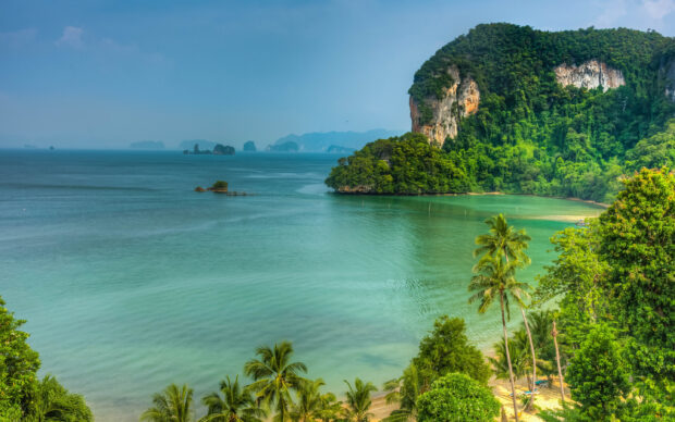 A scenic view of Phuket showcasing turquoise waters and lush green cliffs, 2K Desktop Wallpaper