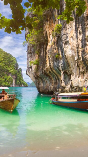 A scenic view of Phuket with turquoise water and traditional boats, HD Phone Wallpaper