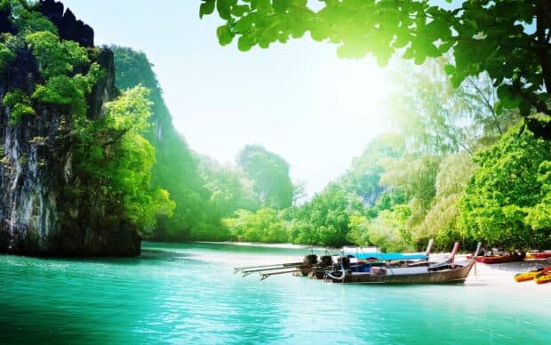 A scenic view of boats near lush islands in Phuket with clear turquoise water, HD Desktop Wallpaper