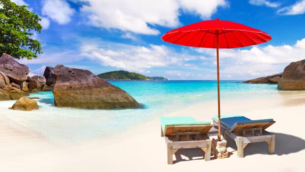 Two lounge chairs and a red umbrella sit on a sandy beach at Phuket with turquoise water, HD Desktop Wallpaper