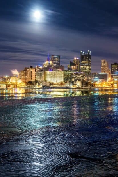The Pittsburgh skyline shines brightly with reflections in the river at night, HD Mobile Wallpaper
