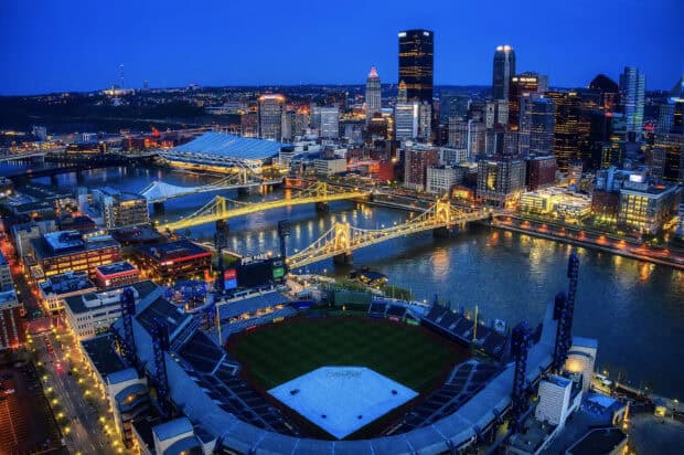 The Pittsburgh skyline displays illuminated bridges and buildings at night, HD Desktop Wallpaper