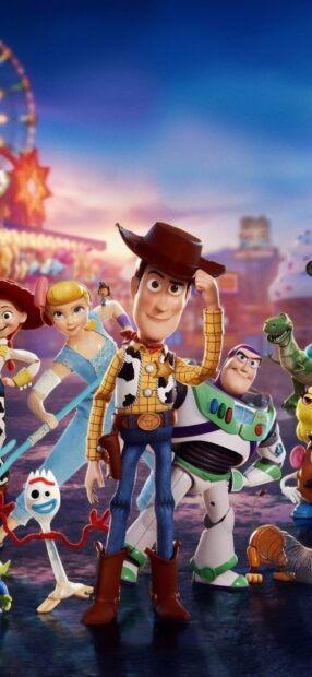The Pixar characters including Woody and Buzz are gathered in a colorful amusement park setting, HD Phone Wallpaper