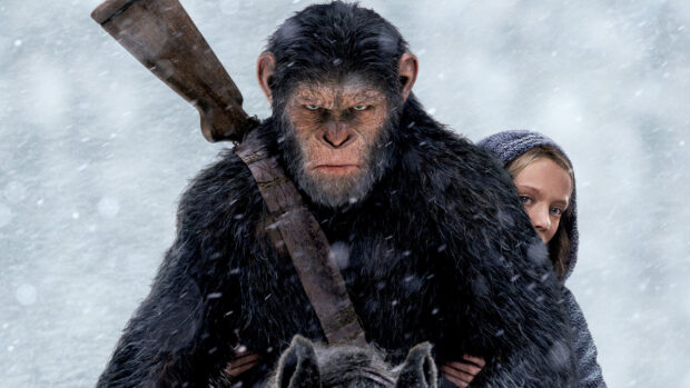 A focused ape carrying a girl in a snowy environment in Planet Of The Apes Wallpapers, 2K Desktop Wallpaper