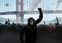 A group of apes raises their fists in protest under the bridge in a Planet of the Apes scene, 4K Desktop Wallpaper