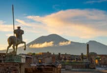 The Pompeii Wallpapers show ancient ruins with Mount Vesuvius rising in the background under a cloudy sky, HD Desktop Wallpaper