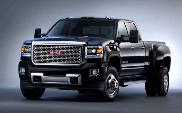 A black GMC Sierra is shown in a studio setting highlighting its design, HD Desktop Wallpaper