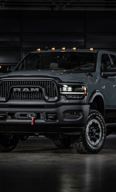 A powerful Ram truck with rugged tires is parked indoors, HD Mobile Wallpaper