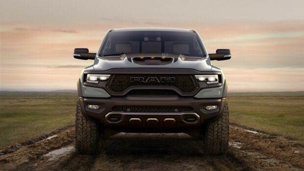 This Ram truck wallpapers shows a rugged vehicle on a dirt path under a colorful sky, HD Desktop Wallpaper