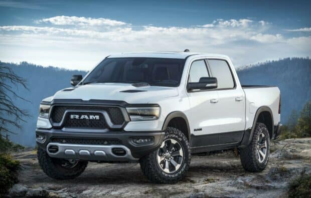 A white Ram truck parked on rocky terrain with mountains in the background, HD Desktop Wallpaper