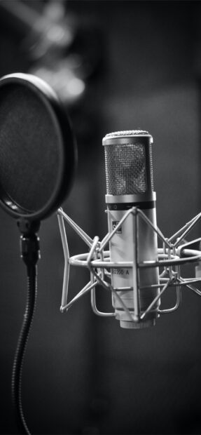 A professional studio microphone setup for clear audio recording in a soundproof room, 2K Mobile Wallpaper