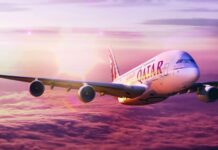 The Airbus A380 is flying above purple clouds during sunset, HD Desktop Wallpaper