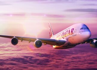 The Airbus A380 is flying above purple clouds during sunset, HD Desktop Wallpaper