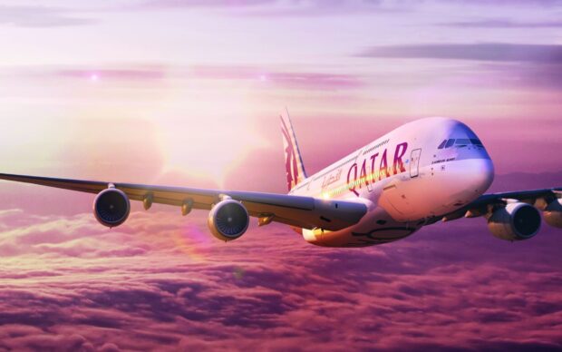 The Airbus A380 is flying above purple clouds during sunset, HD Desktop Wallpaper
