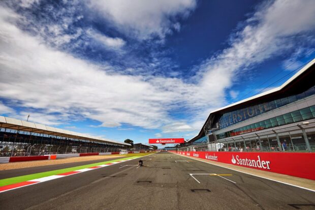 A clear view of the race track at Silverstone with a cloudy sky above, HD Desktop Wallpaper