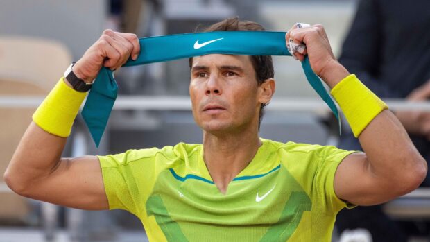 Rafael Nadal adjusting his headband during a French Open Roland Garros match, 2K Desktop Wallpaper