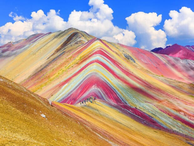 The rainbow mountain in Peru showcases vibrant colors and attracts many tourists, HD Desktop Wallpaper