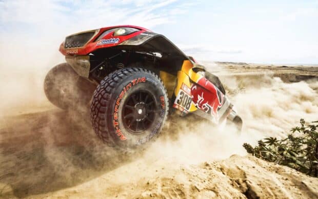 A rally raid vehicle kicks up dust during a desert race with number 308 visible, 2K Desktop Wallpaper