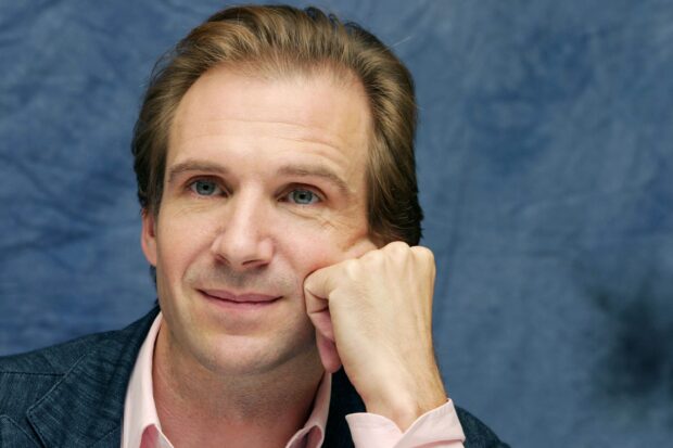 Ralph Fiennes close up portrait showing his thoughtful expression and light blue eyes, 2K Desktop Wallpaper