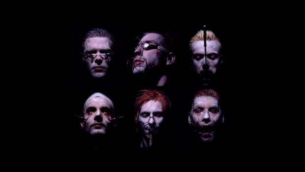 The image shows six Rammstein band members with dark artistic makeup and props, HD Desktop Wallpaper