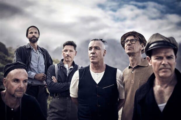 The Rammstein band members pose outdoors with cloudy sky behind them, HD Desktop Wallpaper