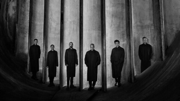 The Rammstein band members stand separated by concrete pillars in a dark environment, HD Desktop Wallpaper