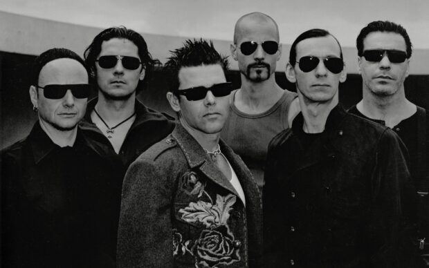 The Rammstein band poses together wearing dark sunglasses and stylish outfits, 2K Desktop Wallpaper