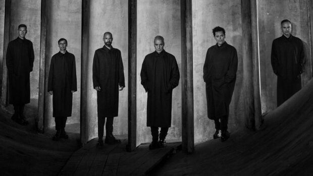 The Rammstein band members pose together in a black and white corridor setting, HD Desktop Wallpaper