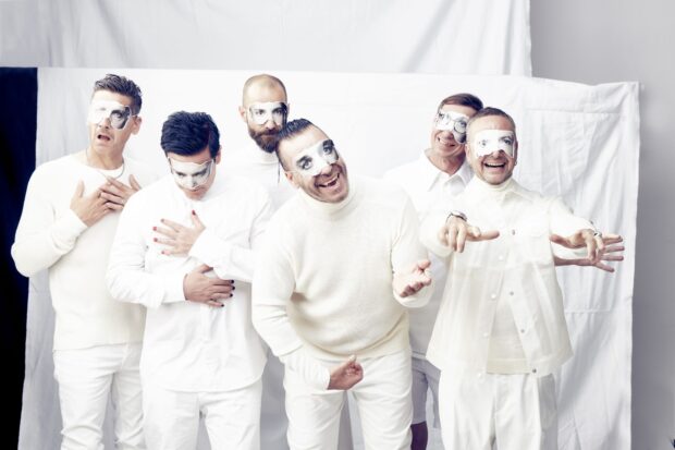 This image features Rammstein band members dressed in white with face masks showing eyes, HD Desktop Wallpaper