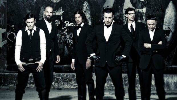 The Rammstein band poses in formal suits against a graffiti covered wall, HD Desktop Wallpaper